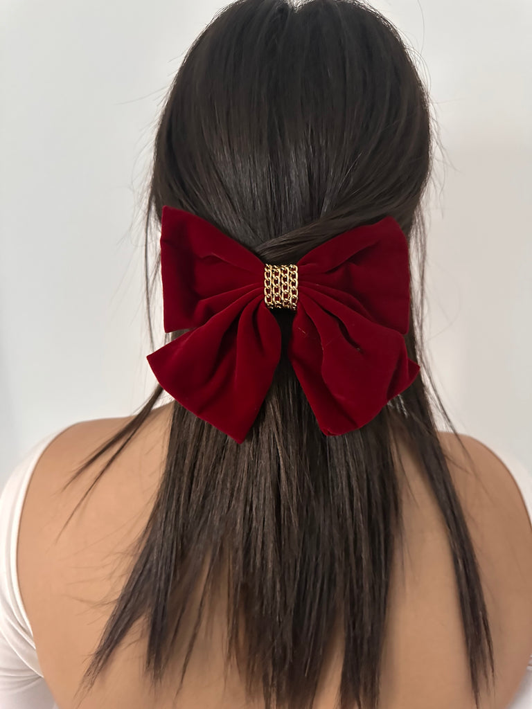 Fiocco Étoile in velluto bordeaux con anello dorato centrale, elegante accessorio natalizio per capelli.